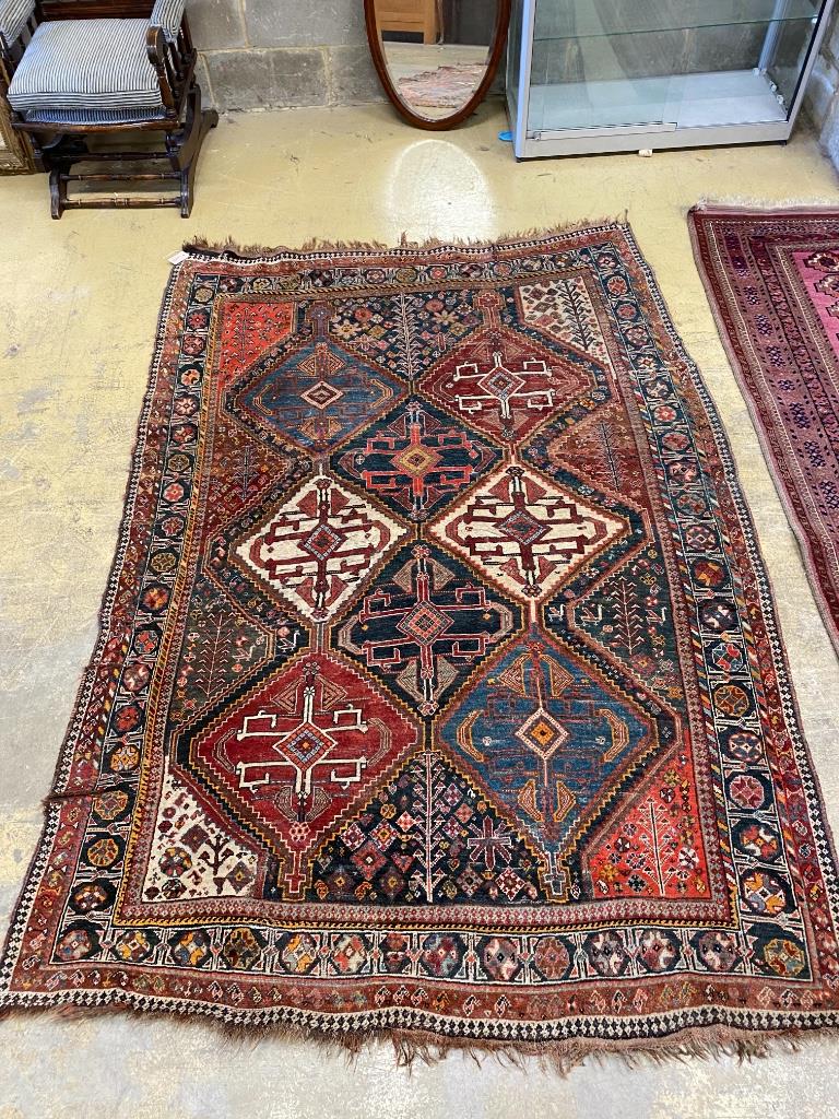 A Caucasian black ground rug, 237 x 159cm